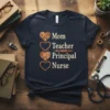 Mom Teacher Principal Nurse text design with heart icons and a fountain pen graphic on a navy t-shirt