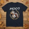 The "Moo?" t-shirt features a cartoon cow dressed in a turkey costume with a bell, surrounded by wheat stalks