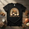 Moo Moo I'm Two t-shirt design featuring a cute Highland cow under a rainbow with text "Moo Moo I'm Two"