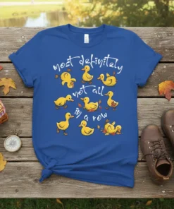 Most Definitely Not All In A Row quote with cute yellow ducks in various poses on a royal blue t-shirt