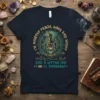 Dark navy t-shirt featuring a woman meditating within a mandala, with text "I'm Mostly Peace, Love and Light and a
