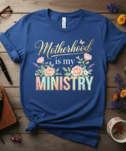 Motherhood is my MINISTRY t-shirt design with floral accents and butterflies, featuring elegant gold and pastel typography