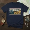 Mountain Dude T-Shirt featuring vintage distressed text and a mountain landscape graphic, perfect for hikers