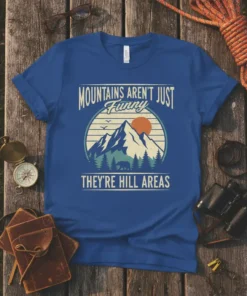 Mountains Aren't Just Funny They're Hill Areas quote t-shirt with mountain, sun, trees, and bear graphic