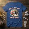 Movies, Popcorn And Pajamas text with cartoon popcorn and clapperboard characters on a blue t-shirt
