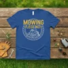 Mowing Legend t-shirt featuring a graphic of a person riding a zero-turn mower within a gear circle