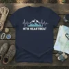 MTN HEARTBEAT t-shirt design with mountain range and heartbeat graphic in white and blue