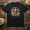 Black t-shirt with "Muhn Ching All You Can Eat Beaver China Buffet" text and a cartoon beaver chef holding a
