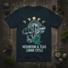 Mushroom and toad illustration with lunar cycle phases on a dark t-shirt, featuring text "MUSHROOM & TOAD LUNAR CYCLE"