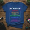 T-shirt with "MY AGENDA: SUNGAY MONGAY TUESGAY WEDNESGAY THURSGAY FRIGAY SATURGAY" in rainbow gradient colors