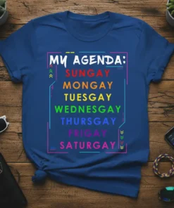 T-shirt with "MY AGENDA: SUNGAY MONGAY TUESGAY WEDNESGAY THURSGAY FRIGAY SATURGAY" in rainbow gradient colors