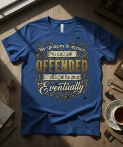 Blue t-shirt with gold and white text quote "My apologies to anyone I've not yet OFFENDED I will get to