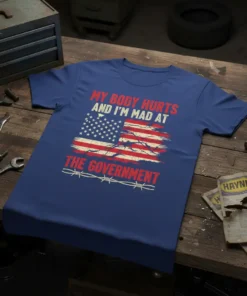 Distressed American flag with text "MY BODY HURTS AND I'M MAD AT THE GOVERNMENT" and barbed wire on a blue