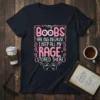 My Boobs Are Big Because I Keep All My Rage Stored There quote t-shirt with pink decorative elements and clenched