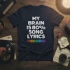 My Brain Is 80% Song Lyrics text with colorful equalizer graphic on a navy t-shirt