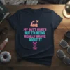 T-shirt with pixelated text "MY BUTT HURTS BUT I'M BEING REALLY BRAVE ABOUT IT" and a pixelated muscle arm graphic