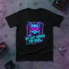 Black t-shirt featuring neon graphic of a cat wearing retro gamer glasses with text "my CAT THINKS I'M COOL."