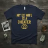 Navy blue t-shirt with yellow text "MY EX WIFE IS A CHEATER" and cracked wedding rings graphic