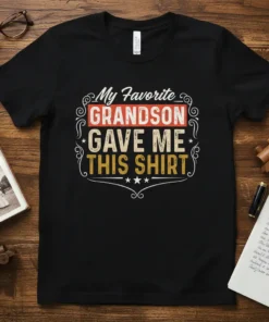 Black t-shirt with "My Favorite GRANDSON GAVE ME THIS SHIRT" text in vintage distressed font and decorative borders