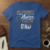 My Favorite Nurse Calls Me Dad text with stethoscope graphic on a blue t-shirt