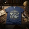 My Favorite People Call Me Grumpy quote in vintage distressed font on a navy blue t-shirt