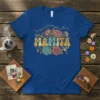 Mamita T-Shirt with "My Favorite People Call Me Mamita" text and floral design, featuring retro lettering and a hummingbird graphic