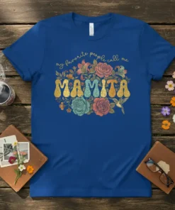 Mamita T-Shirt with "My Favorite People Call Me Mamita" text and floral design, featuring retro lettering and a hummingbird graphic