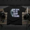 Hockey goalie mask graphic with text "My Goal Is To Deny Yours" on a black t-shirt, ideal for sports enthusiasts