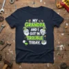 My Grandpa and I Got in Trouble Today text with illustrations of grandpa, child, and cookies on a navy t-shirt