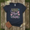 T-shirt with text "My Greatest Blessings Call Me Mom And Auntie" featuring floral and butterfly graphics