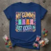 My Gummy Just Kicked In text with colorful gummy bear graphics on a navy blue t-shirt