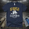 Navy t-shirt with yellow text "MY HEART IS ON THAT MAT" and a white geometric wrestling graphic with "#wrestlingmom" below