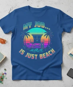 Blue t-shirt with "MY JOB... IS JUST BEACH" text, featuring a retro sunset, lifeguard tower, palm trees, and waves graphic