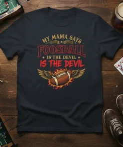 My Mama Says Foosball Is The Devil quote on a dark t-shirt with a football graphic