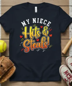 Navy t-shirt with "MY NIECE Hits & Steals!" in bold yellow and orange gradient font, accented with red hearts and
