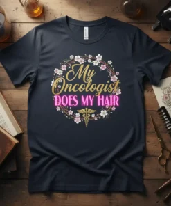 My Oncologist DOES MY HAIR text with floral wreath and caduceus symbol on a dark t-shirt design