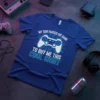 Blue t-shirt with white and light blue text: "MY SON PAUSED HIS GAME TO BUY ME THIS COOL SHIRT" and