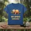 My Spirit Animal t-shirt design featuring a cute, smiling sloth hanging on a tree branch with leaves and fireflies