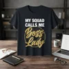 My Squad Calls Me Boss Lady t-shirt with bold white text and a golden circular graphic featuring "Boss Lady" in