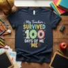My Teacher SURVIVED 100 DAYS OF ME ME ♡ text and colorful graphics on a navy t-shirt, perfect for school