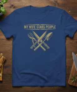 T-shirt with "My Wife Stabs People" text and crossed gardening tools graphic