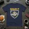 Nailed It t-shirt design with a graphic of two cars colliding, yellow burst, and white shield outline