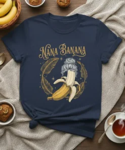 Nana Banana text with a peeled banana wearing a bun hairstyle, surrounded by golden leaves on a navy t-shirt