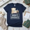 Nana's Favorite graphic t-shirt design with a cozy armchair, blanket, and teacup, featuring "Nana's Favorite" text