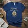 Nana's Favourate text with a detailed sunflower graphic on a navy blue t-shirt
