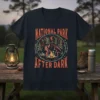 National Park After Dark t-shirt with Bigfoot, alien, and campfire design, featuring vintage distressed text