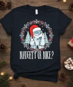 Naughty Or Nice? Christmas Yeti T-Shirt with Santa hat and festive wreath design