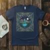 NE W N S WE compass design with mountains, lake, and moon on a navy blue t-shirt