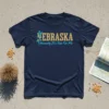 Navy blue t-shirt with "NEBRASKA Honestly It's Not For Me" text and corn graphic
