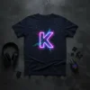 Neon Letter K design with glowing purple and teal circuits on a dark t-shirt
